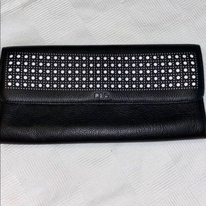 Black letter clutch with white polka dots detail